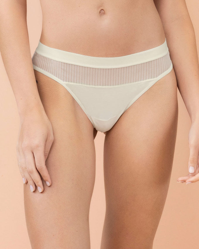 Eco-friendly thong panty with tulle details and ultra-flat waistband#color_253-ivory